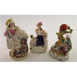 19th Century Staffordshire figure depicting a standing lady in plumed hat cradling a lamb, 7.5" h...