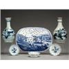 Image 1 : Two 19th Century Oriental bottle shaped vases with blue and white landscape decoration, 9" high -...