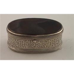 19th Century oval white metal box having engraved foliate decoration, the hinged cover with inset...