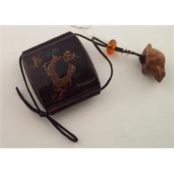 Japanese lacquered three section inro with an attached carved nut netsuke formed as a frog Est.:...