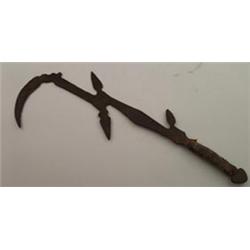 Antique African ethnic iron throwing knife having primitive engraved decoration and a snakeskin b...