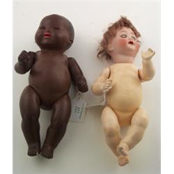 Armand Marseille black baby doll with bisque head having sleeping eyes and open mouth, stamped 35...