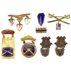 Collection of 8 misc. pins and medals.