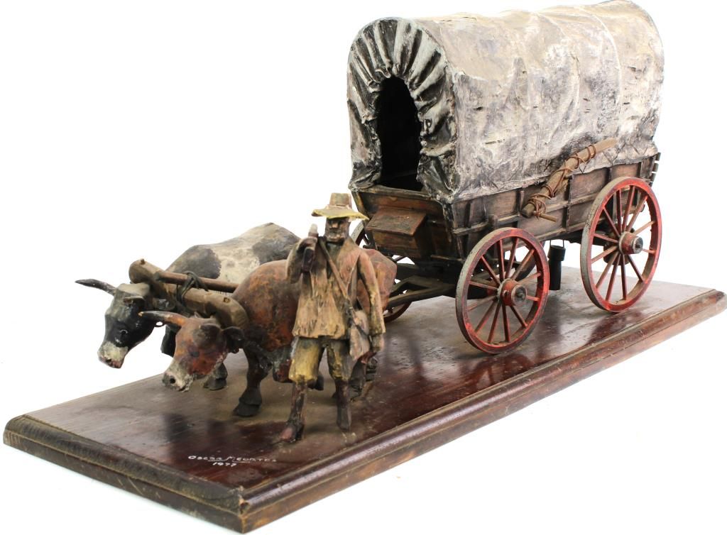 Hand carved wooden covered wagon
