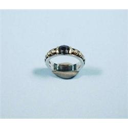 CARTIER - An 18 kt. white gold band with yell...