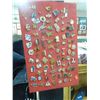 Image 1 : RED CARD WITH LARGE ASSORTMENT OF COLLECTOR PINS