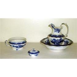 Flow blue chamber set by W.H. Grindley. Perth pattern. Pitcher, bowl, soap dish, and pot. No lid...