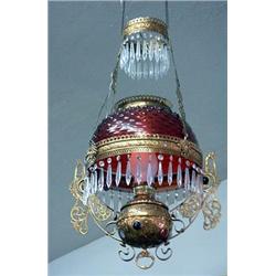 Cranberry hanging lamp. Hobnail and thumbprint design in unusual ornate and jeweled brass frame....