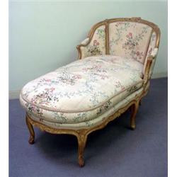 Chaise lounge with carved buffed gilt frame in the style of Louis XV. Embossed floral and basket...