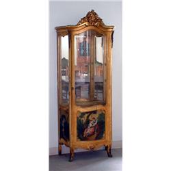 French vitrine. Curved front glass and side panels. Mirrored back. High relief carving on crest....