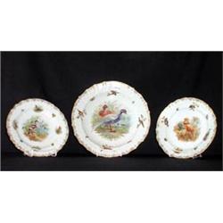 Twelve Dresden plates and two chargers. Decorated with exotic birds and insects. Gold edges. $80...