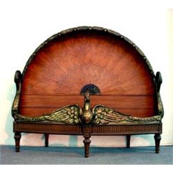 Carved and inlaid swan bed. Inlaid head board simulates decorative spread wing design flanked by...