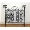 Image 1 : Unusual cast-iron fireplace gate. Twisted column sides support urn-shaped holder. Center section...