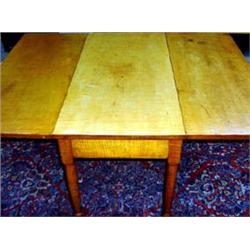 Tiger maple drop-leaf table. One board top and drops. Turned and tapered legs. 28  h X 55  w X 3...