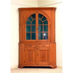 Southern pine corner cupboard. Arched door with glass light shaped shelves with spoon nothches....