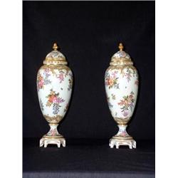 Pair of French porcelain mantel urns with lids. Hand-painted floral decoration. Marked in lid S....