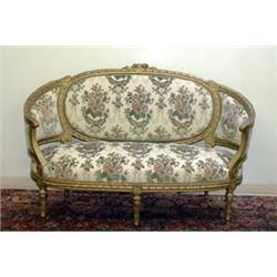 Carved French style Louis XV style love seat. Floral carvings along the back, gold-painted frame...