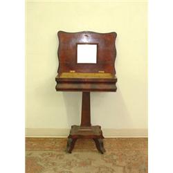 Empire cherry dressing stand. Ogee framed. Simple rectangular veneered base and pedestal support...