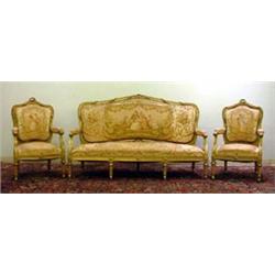 Carved Louis XVI style three-piece parlor set. Gilt and gold leaf carved floral decorations thro...