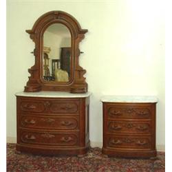 Bow front Victorian dresser with mirror. Matching washstand. White marble tops. Full carved leaf...