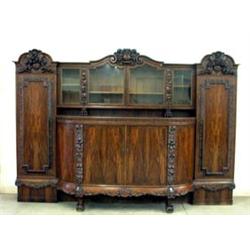 Seven piece German Rosewood dining room set. Highly carved sideboard with urn and high relief nu...