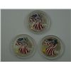 Image 1 : A trio of Uncirculated Colorized 1 oz. Silver Eagles