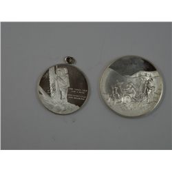 A pair of Apollo program sterling silver medals