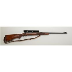 Winchester Model 70 bolt action rifle, .375 Magnum cal., 25” barrel, blue finish, checkered wood sto