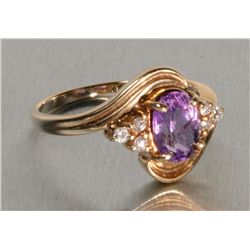 One 14k yellow gold ladies ring set with an oval amethyst and 6 fine side diamonds. Estimate $100-15