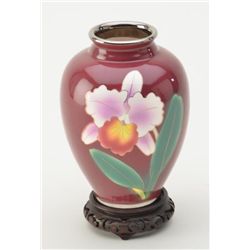 Beautiful oriental style glazed porcelain vase with silver trim. Est.: $50-$100