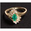 Image 1 : Dazzling ladies 4k yellow gold ring, with a sparkling oval center set emerald approx .5ct, and featu