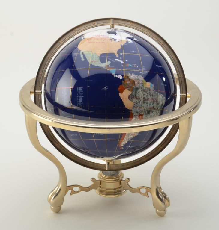 Globe of the world made from polished stones and inlaid with brass with
