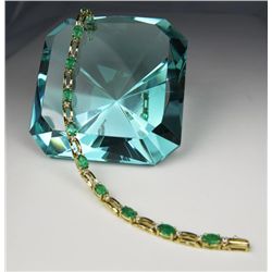 Elegant Colombian Emerald Bracelet with 11 oval emeralds weighing approx. 7.00 carats total accented