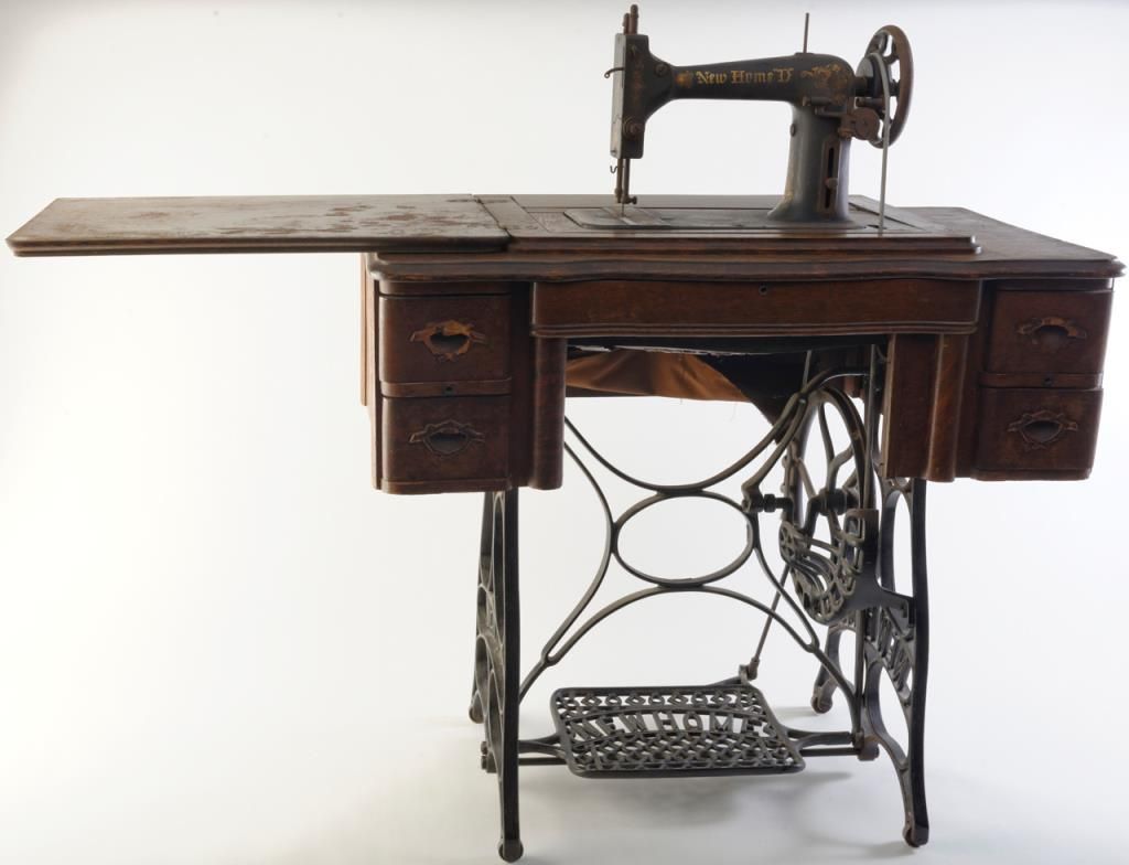 Antique New Home Model D peddle sewing machine in quarter sawn wood