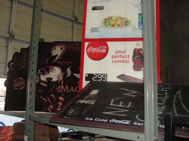LOT OF ASSORTED COCA COLA AND MAGNUM ICE CREAM BAR SIGNS
