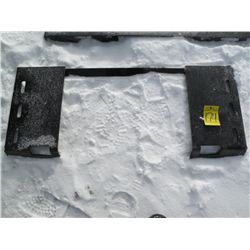 Tool plate for skid loader