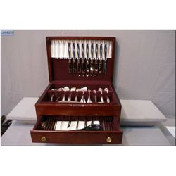 A wooden canteen containing settings for nine of Rogers Bros.  Daffodil  flatware including dinner f