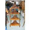 Image 1 : A four tier Victorian burl walnut étagère with fretwork backs and porcelain castors