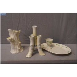 A selection of Irish Belleek including black mark four branch vase, a green mark tree trunk vase and