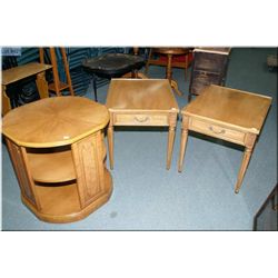 A pair of single drawer side table with tapered supports and a round two tier occasional table