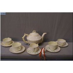A selection of vintage Belleek Irish porcelain including Nautilus teapot, and five cups and  saucer,