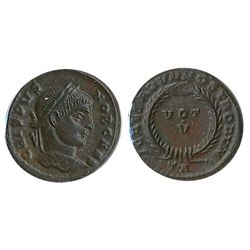 Roman Imperial Coinage; Crispus Follis. Obv: CRISPVS NOB CAES; Rev: VOT / V within wreath.  Arelate 