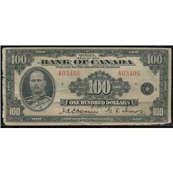 1935 $100 BC-15 #A03406.  VG for grade with raggy borders and center tear.