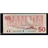 Image 1 : 1988 $50 BC-59aA #EHX1010870 Below(1,7m).  Crisp AU/UNC issue.