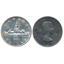 1957 $1 ICCS MS64.  Strong tones under intense green and gold tones.