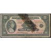 Image 1 : 1935 $20 BC-10 #F013954.  A better french issue, Repaired with dark glue residue.  VG+ for grade.