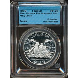 RCM Lot;  includes 1989 $1 Silver CCCS PF70 Ultra Heavy Cameo.  Commemorates MacKenzie River Bicente