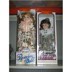 Two porcelain dolls in boxes