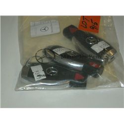 Three Mercedes electronic key fobs