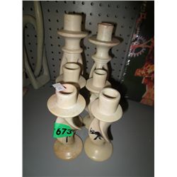 Three pairs of carved African candle holders